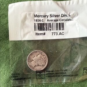 Mint Mercury Silver Dime in Clear Packaging on Green Fabric